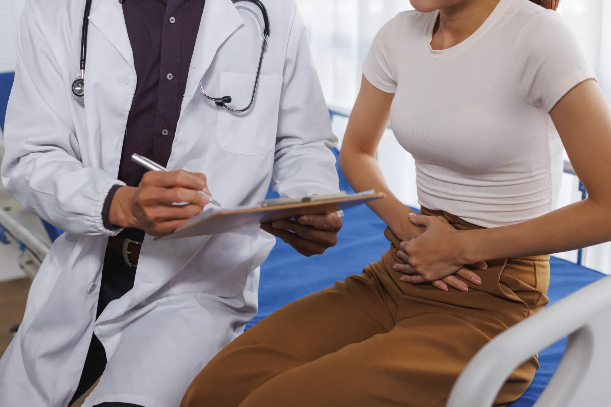 A patient undergoing a consultation with a gastroenterologist