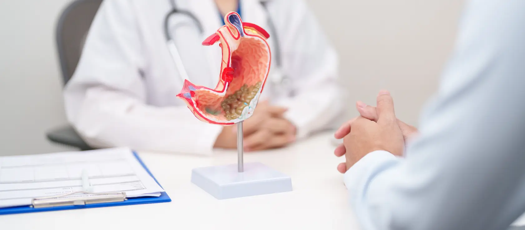 A patient consulting a gastroenterologist