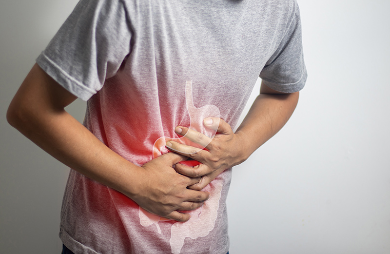 A man experiencing abdominal pain