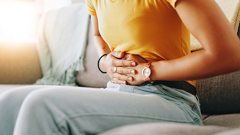 A patient experiencing discomfort due to gastritis