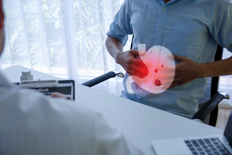A man visiting a doctor for acid reflux