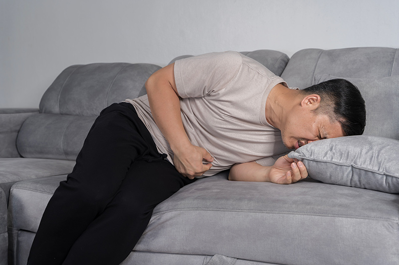 A man experiencing urgent symptoms of gastrointestinal distress